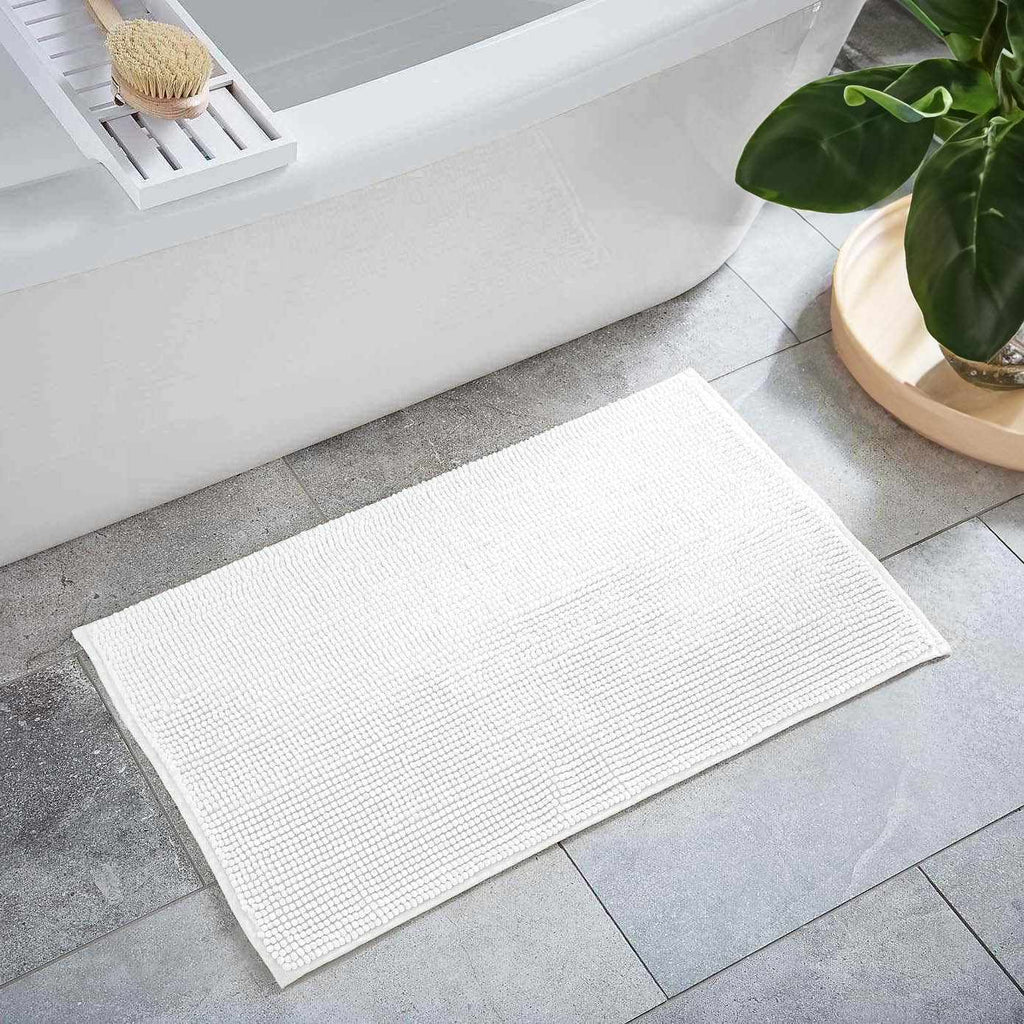Plush solid white washable bath mat made of thick absorbent polyester for bathroom floors — view 3