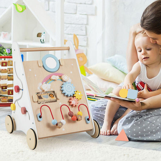 White wooden baby walker with activity center and rubberized wheels for early learning — view 4