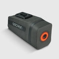 Black waterproof bicycle saddle bag with integrated smart taillight mounted securely under a bike seat