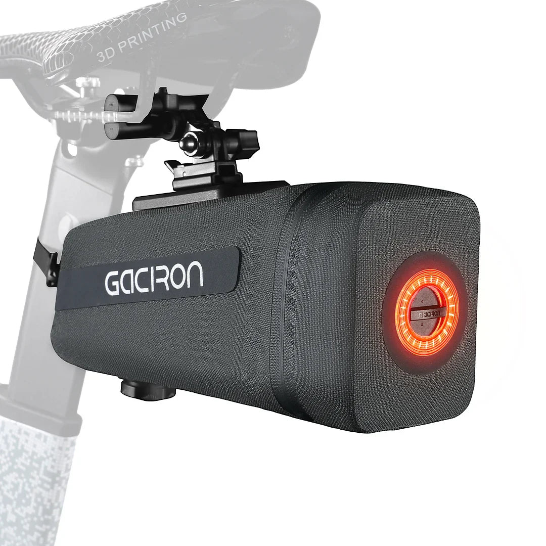 Black waterproof bicycle saddle bag with integrated smart taillight mounted securely under a bike seat — view 2