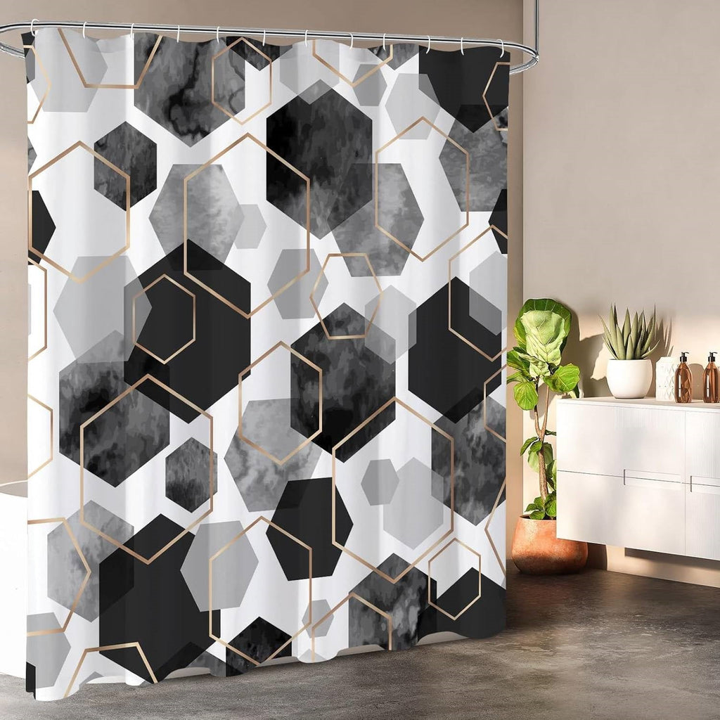 Black and white hexagonal pattern polyester shower curtain with metal grommets and plastic hanging hooks.