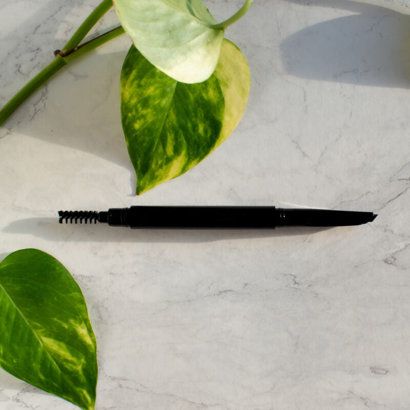 Black automatic eyebrow pencil with angled tip and spoolie brush in recyclable packaging. — view 6