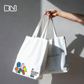 BN canvas tote bag with vibrant geometric pop-art doodles on soft creamy cotton base