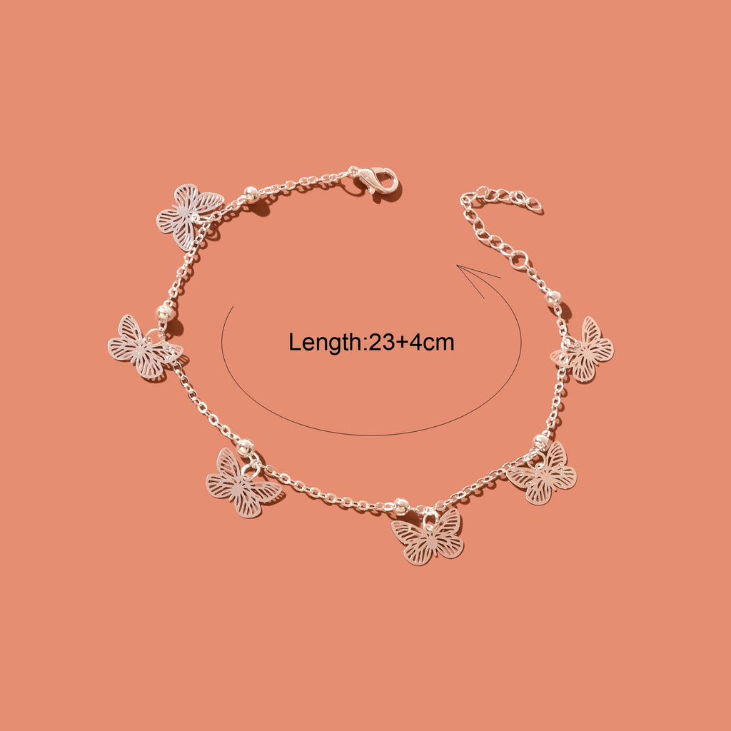 Silver-tone butterfly charm anklet chain displayed as delicate boho beach foot jewellery. — view 4