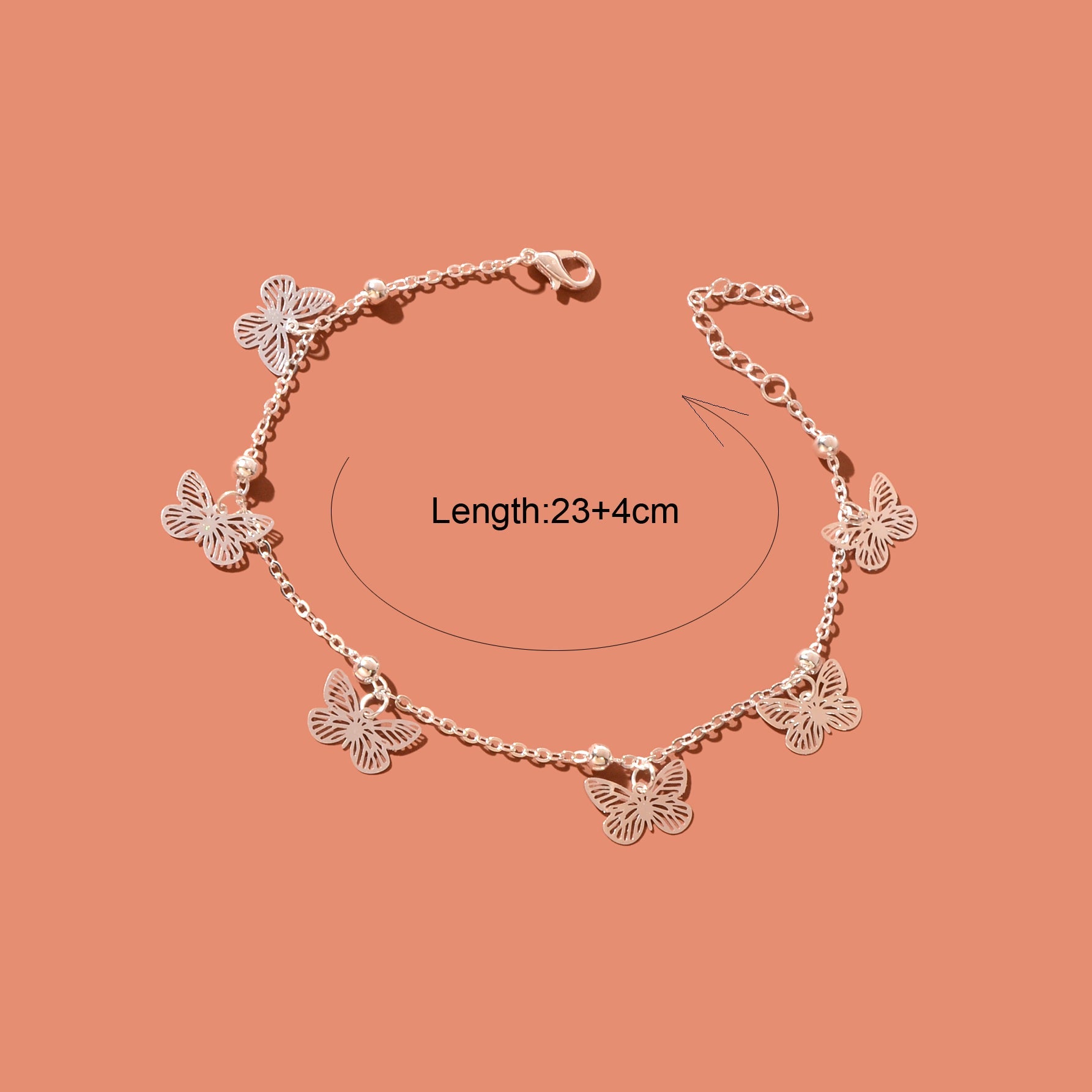 Silver-tone butterfly charm anklet chain displayed as delicate boho beach foot jewellery. — view 4