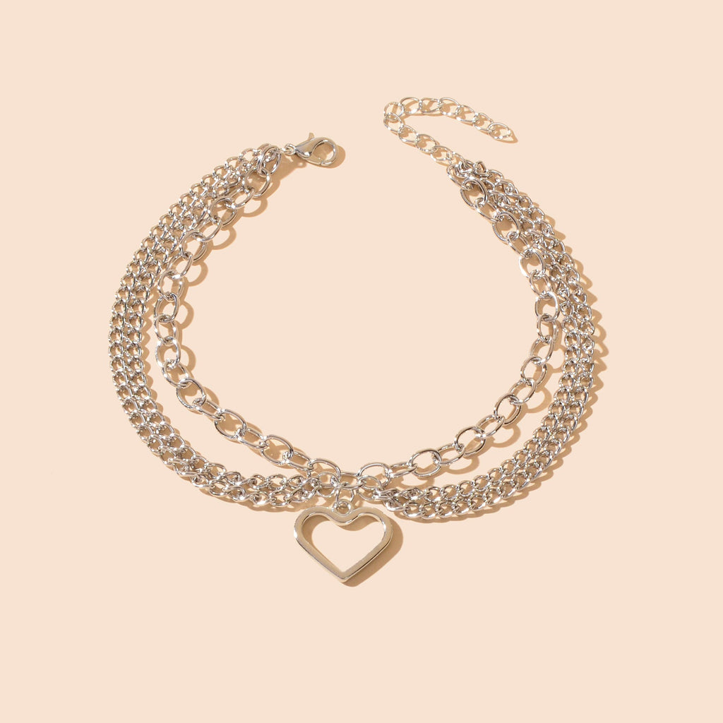 Multi-layer silver chain beach anklet featuring a delicate dangling tassel and a decorative heart charm — view 2
