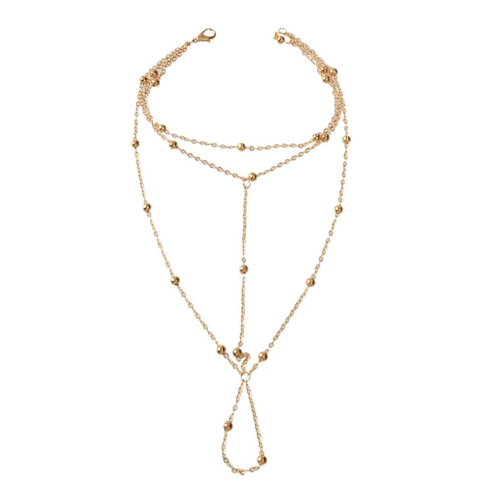Gold chain boho layered anklet with toe ring attachment, elegant barefoot sandal foot jewellery. — view 5
