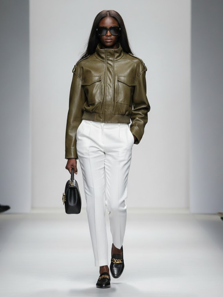 Broadway vegan bomber jacket in olive green faux leather with high collar and flap pockets.