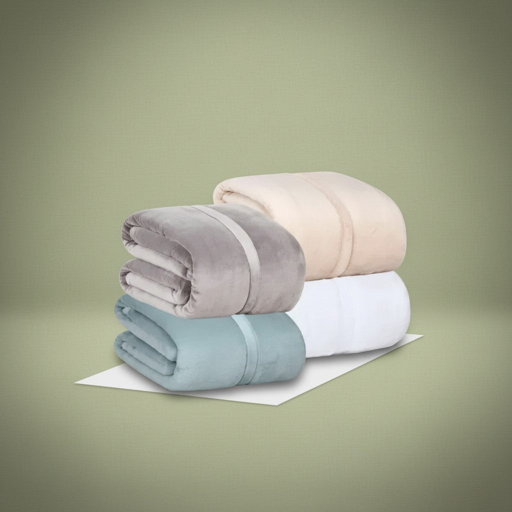 BSB collection plush fleece blanket with suede mink binding folded on a comfortable modern bed