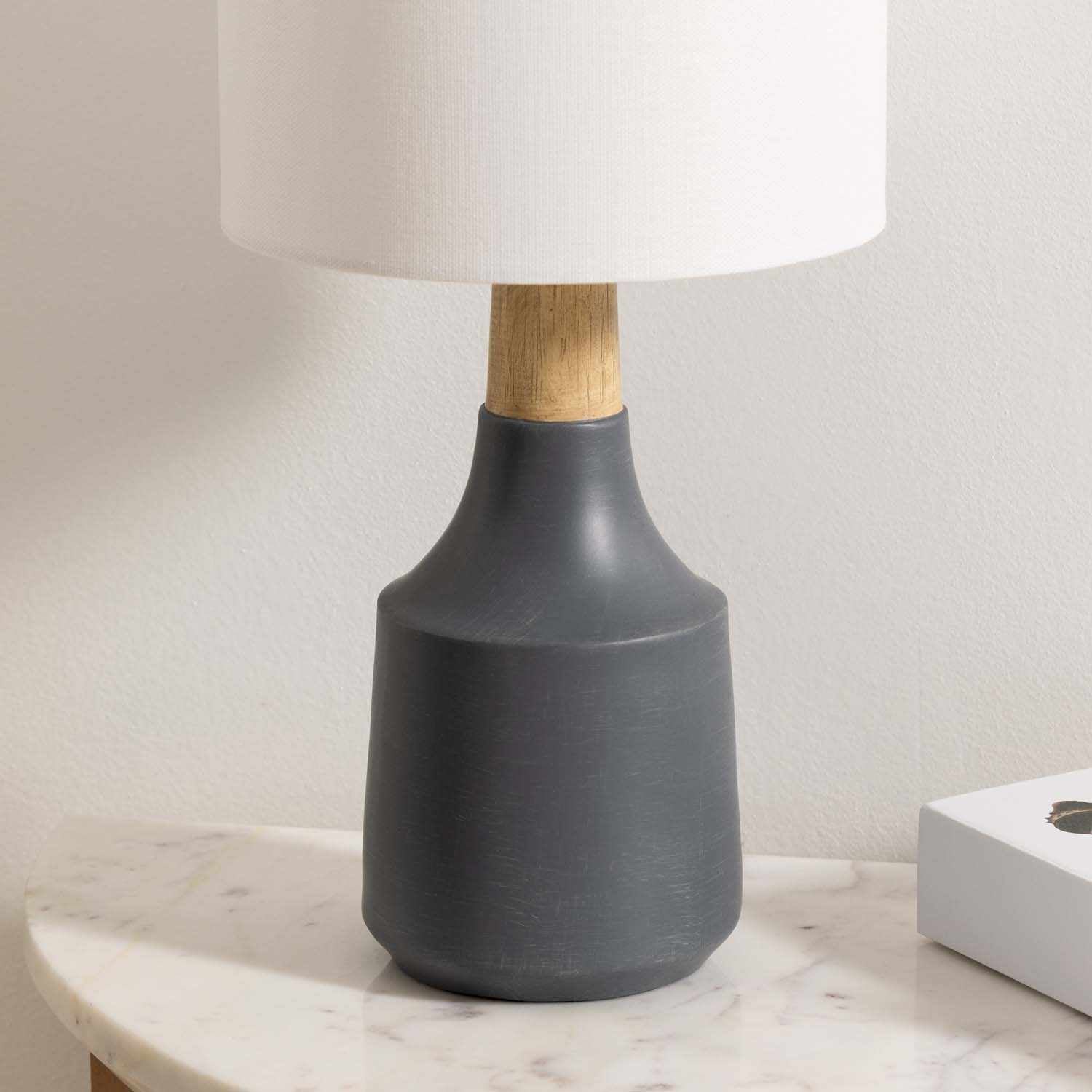 Contemporary Buharkent table lamp featuring a translucent gray resin base and white linen drum shade. — view 4