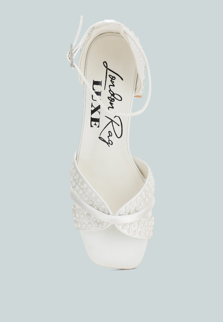 White satin low block heel sandals featuring elegant pearl embellished midfoot straps and adjustable buckles — view 4
