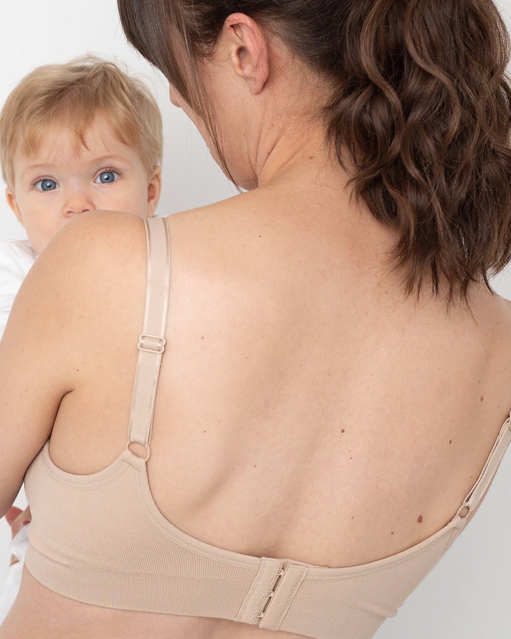 Beige seamfree maternity and nursing bra, featuring non-wired support, drop down cups, and ribbed underband — view 5