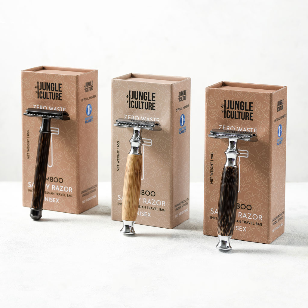 Reusable bamboo safety razor with long wooden handle and stainless steel head alongside kraft packaging