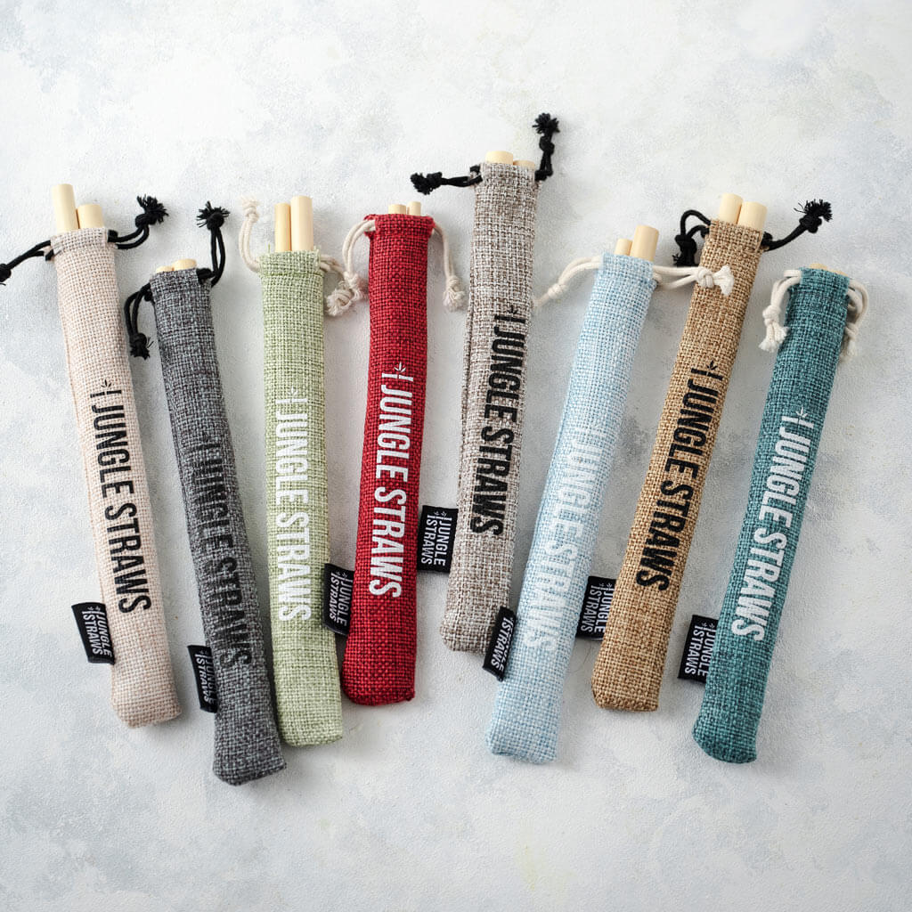 Set of six reusable bamboo drinking straws with a natural jute travel pouch and cleaning