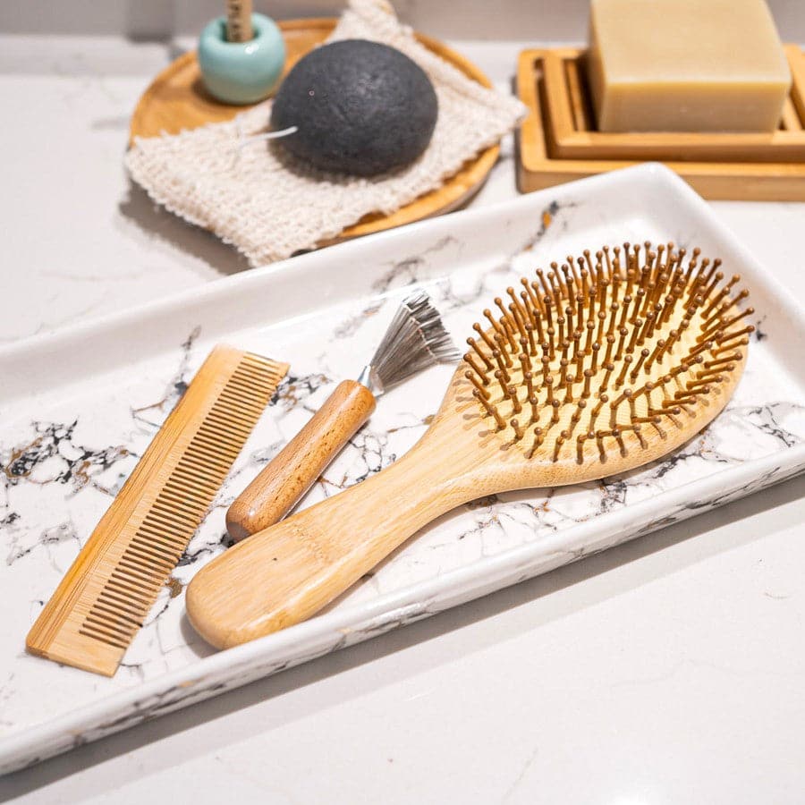 All-in-one bamboo hair brush set including paddle brush, travel brush, comb, and brush cleaner tool — view 2