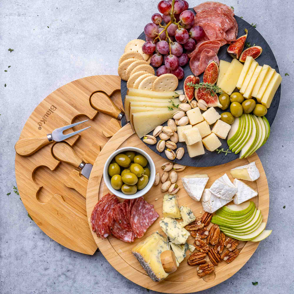 Round bamboo cheese board with removable slate, hidden drawer, and four stainless steel serving knives. — view 4