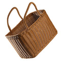 Brown woven wicker basket with handle, stylish retro design for picnics and floral home decor