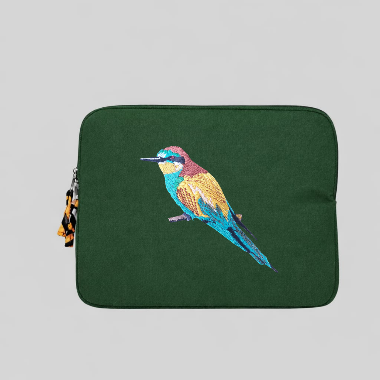 Bee eater laptop sleeve crafted from cotton canvas featuring detailed bird embroidery in earthy colors. — view 3