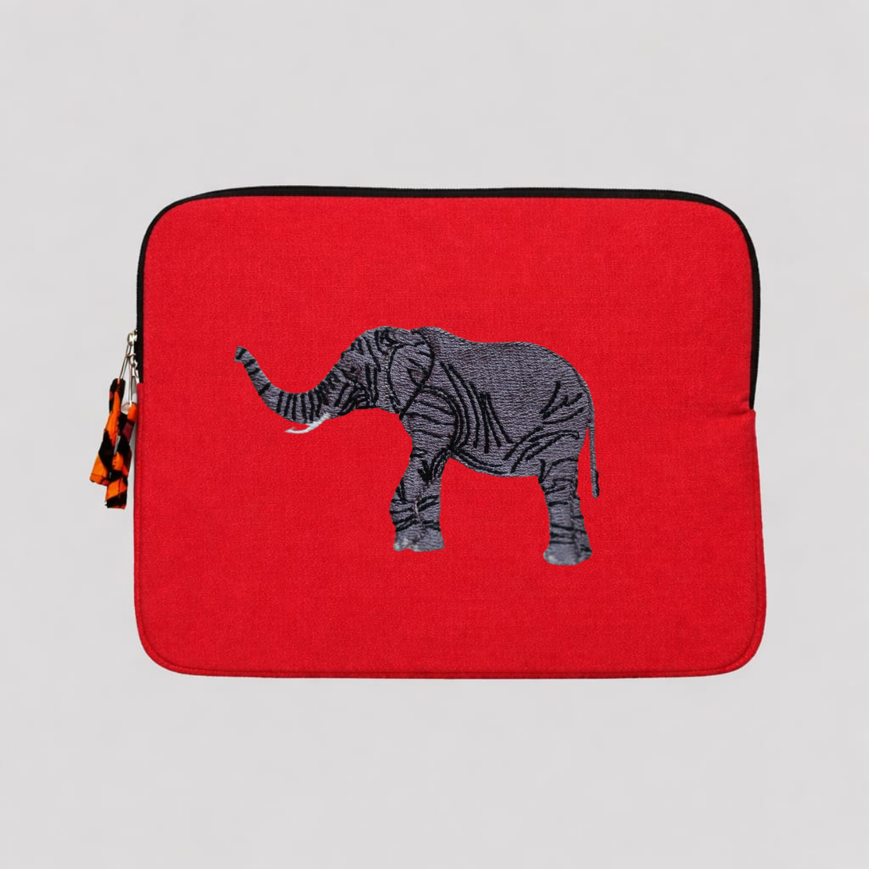 Elephant laptop sleeve in warm earthy cotton canvas with beautifully stitched savanna wildlife embroidery details. — view 5