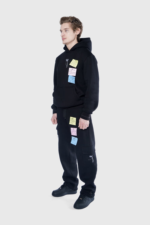 Sticky notes sweatpants in a stacked flared fit with utility pockets and custom interactive detailing — view 2