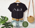 Skeleton Yoga Shirt featuring a dancing skull graphic on a soft unisex cotton t-shirt