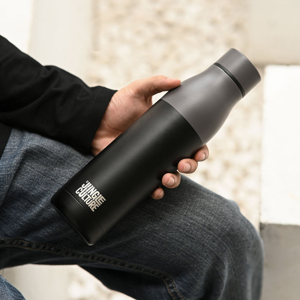 Reusable stainless steel water bottle in sleek matt black finish with an airtight screw lid — view 3