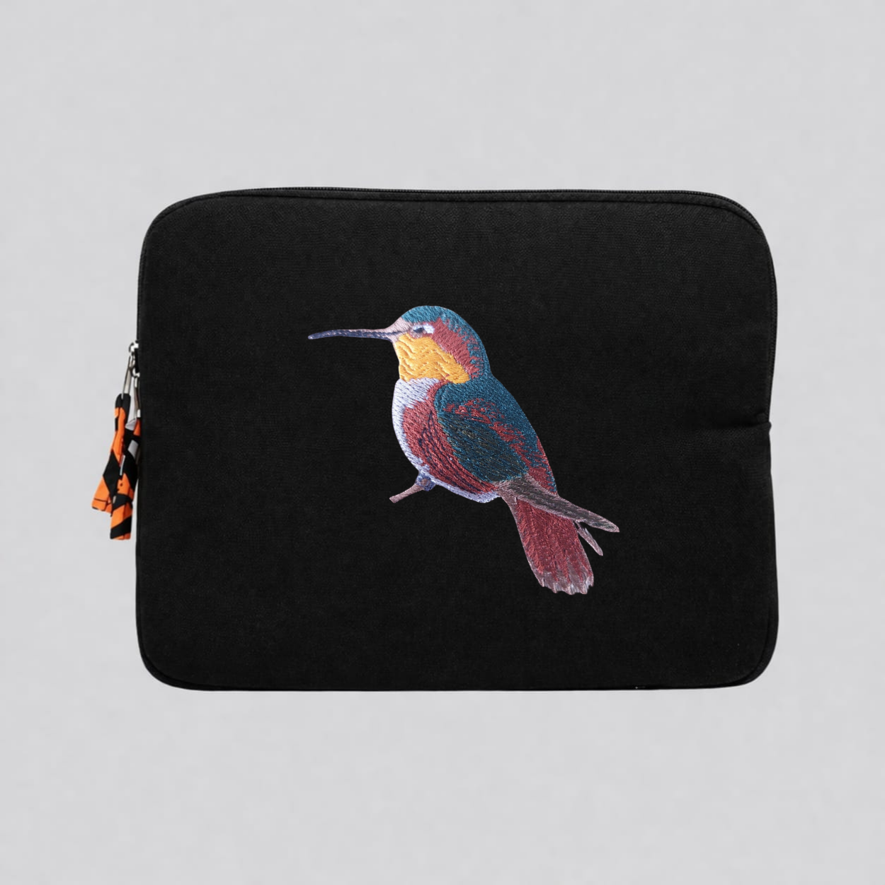Handmade cotton canvas 13 inch laptop sleeve featuring detailed hummingbird embroidery in warm earthy tones — view 4