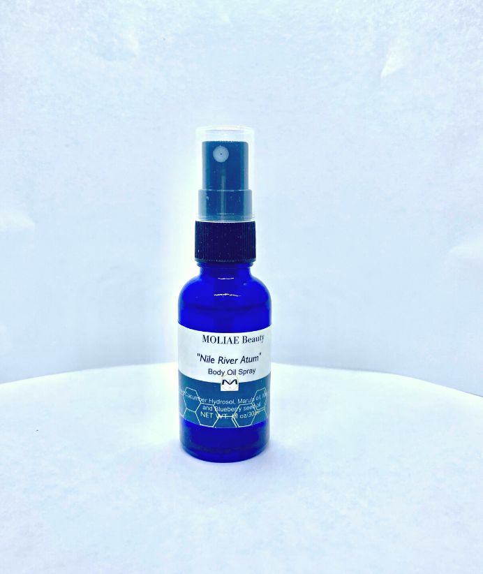 Blue Nile Atum body oil spray bottle with organic cucumber and blueberry seed oil extract