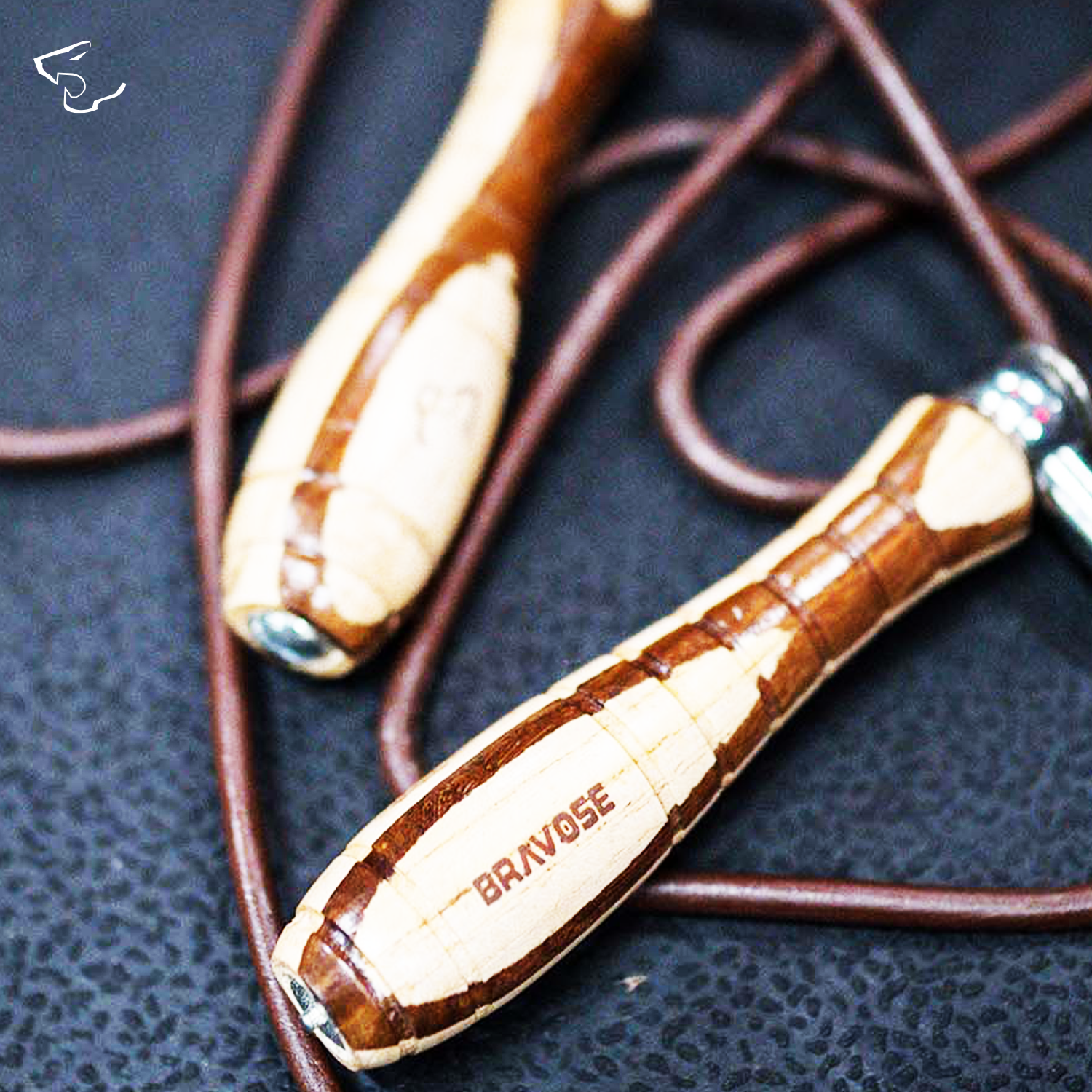 Premium leather skipping rope with ergonomic wooden handles and adjustable nine foot tangle free cord — view 2