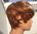 Short women's wig with brown and golden blonde highlights made of synthetic hair