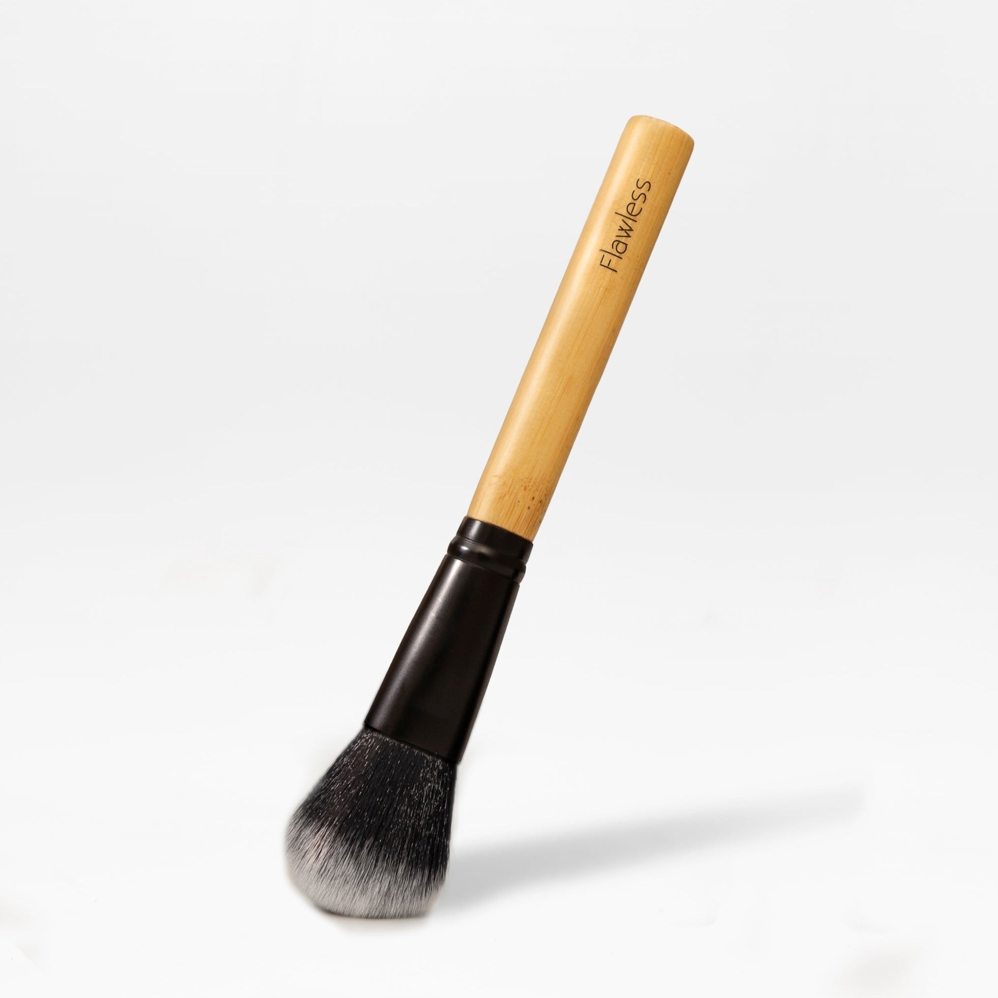 Vegan contour makeup brush with angled soft bristles and a natural bamboo handle