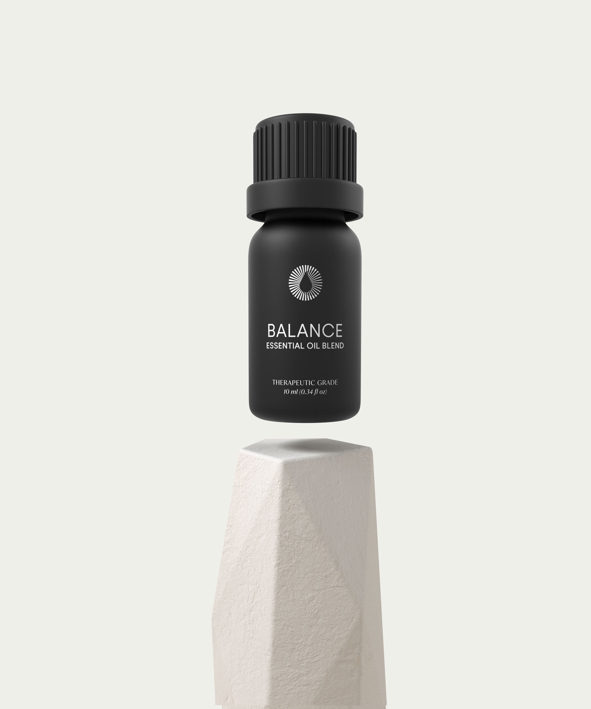 Balance Essential Oil Blend amber glass dropper bottle with natural botanical background — view 2