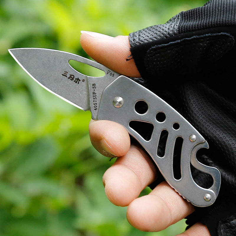 Bushcraft folding pocket knife featuring a stainless steel blade and lightweight polished openwork handle