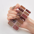 Butterfly laser nail stickers in bronzing color for chic and easy DIY manicure styling.
