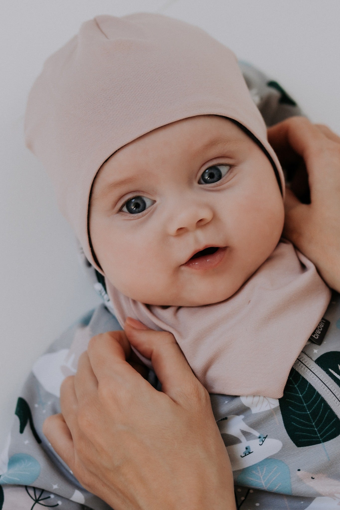 Winter merino baby hat in balaclava style covering the head, ears, and neck.