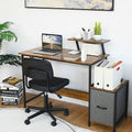 Brown industrial computer desk with raised monitor shelf, fabric drawer, and built-in power ports