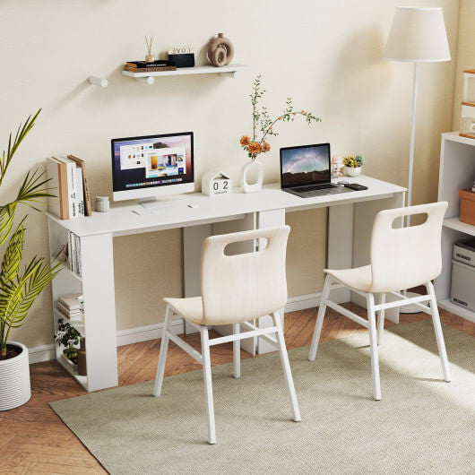 Compact white computer desk with open bookshelf in a small modern home office space — view 2