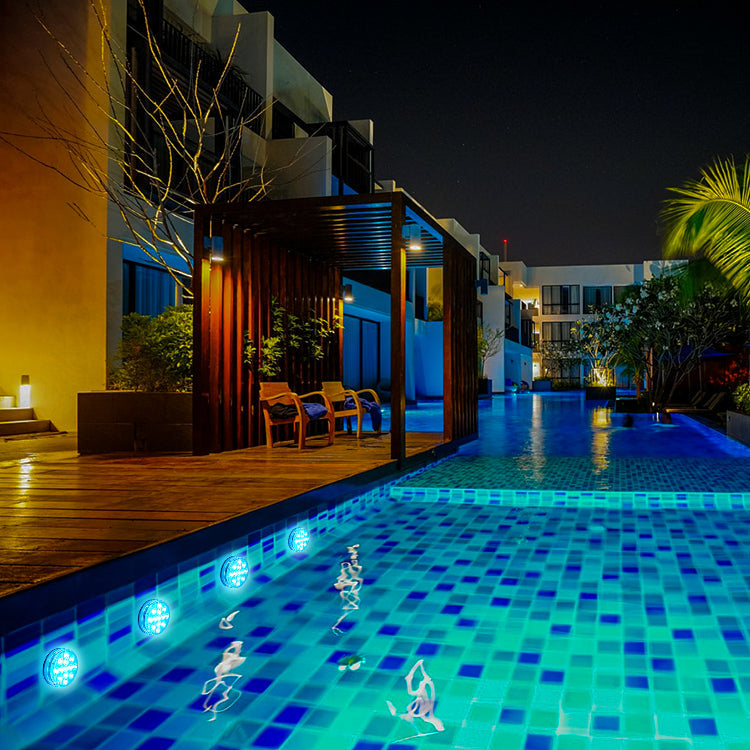 Waterproof submersible LED pool light showing 16 RGB colors with remote control in water setting — view 3