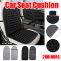 Ergonomic black vehicle seat cushion with raised magnet massage bumps and reinforced edging