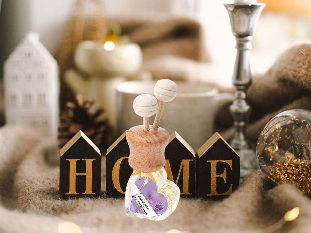 Floral vent car diffuser in sleek glass bottle with wooden reed sticks and sturdy mounting clip — view 3
