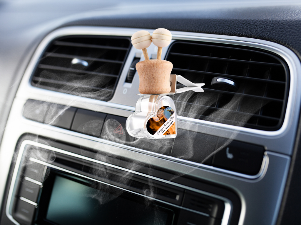 Warm and cozy car vent diffuser in compact glass bottle with wooden cap and fragrance sticks