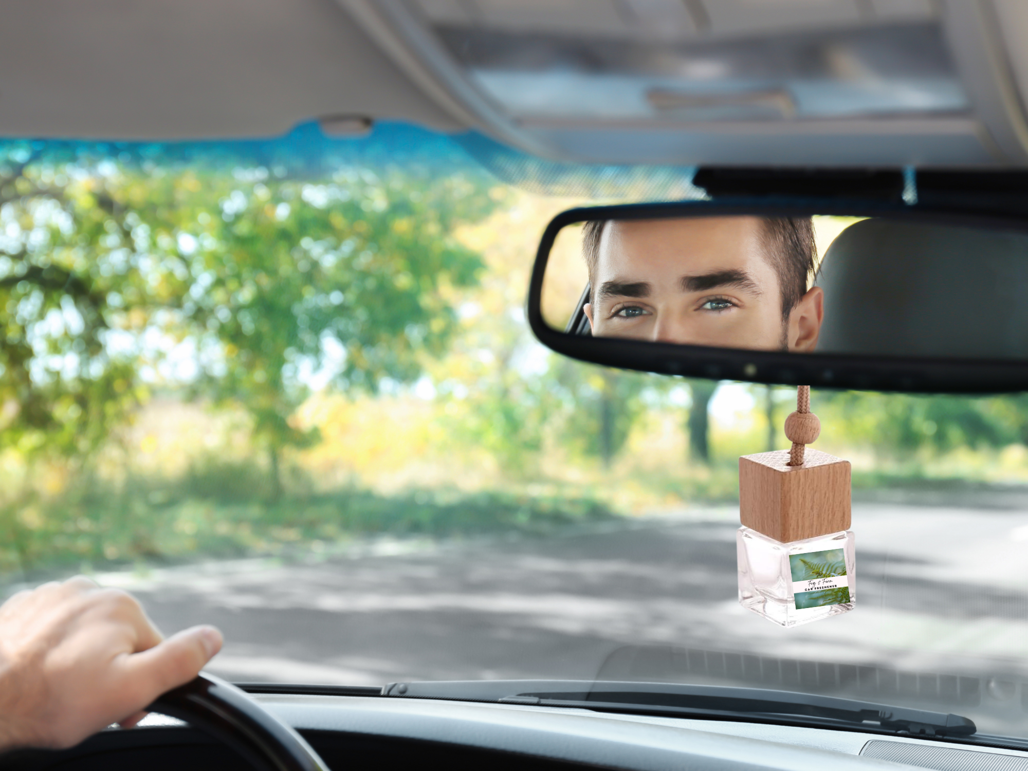 Hanging car freshener glass bottle with minimalist wooden cap and attached rope for continuous fragrance. — view 2
