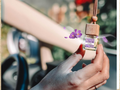 Glass hanging car freshener bottle with natural wooden cap and rope filled with floral scented oil