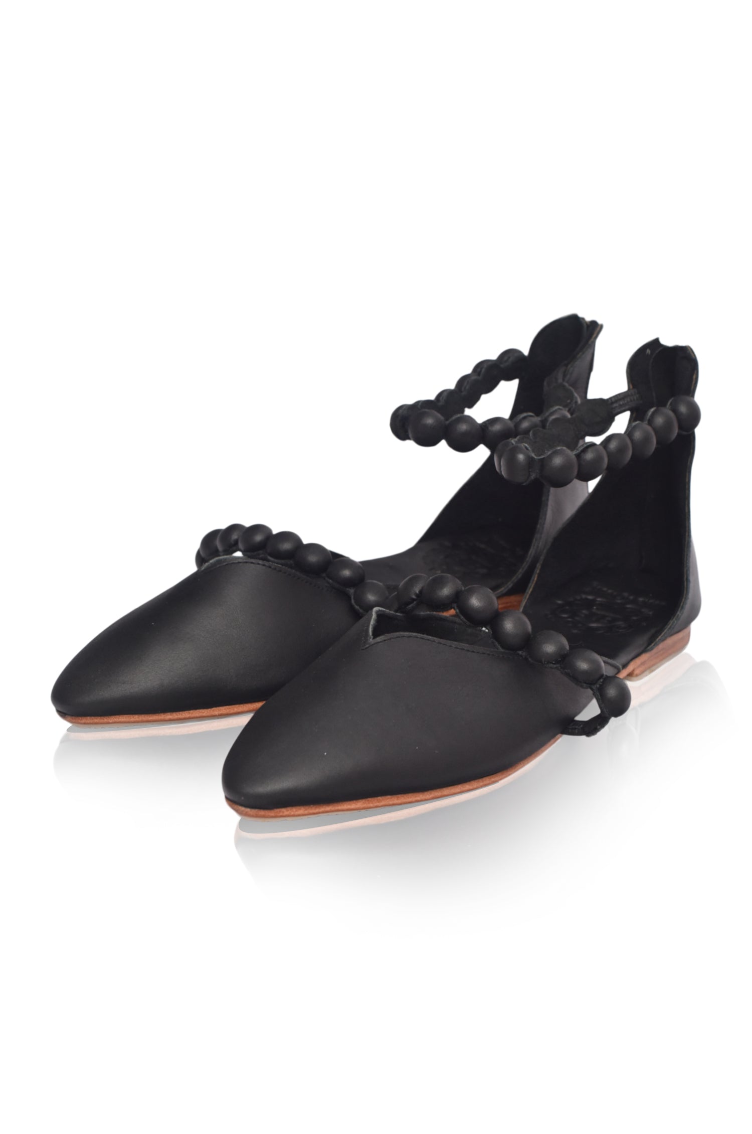 Black genuine leather ankle strap ballet flats with pointed toe and leather-wrapped buttons — view 4