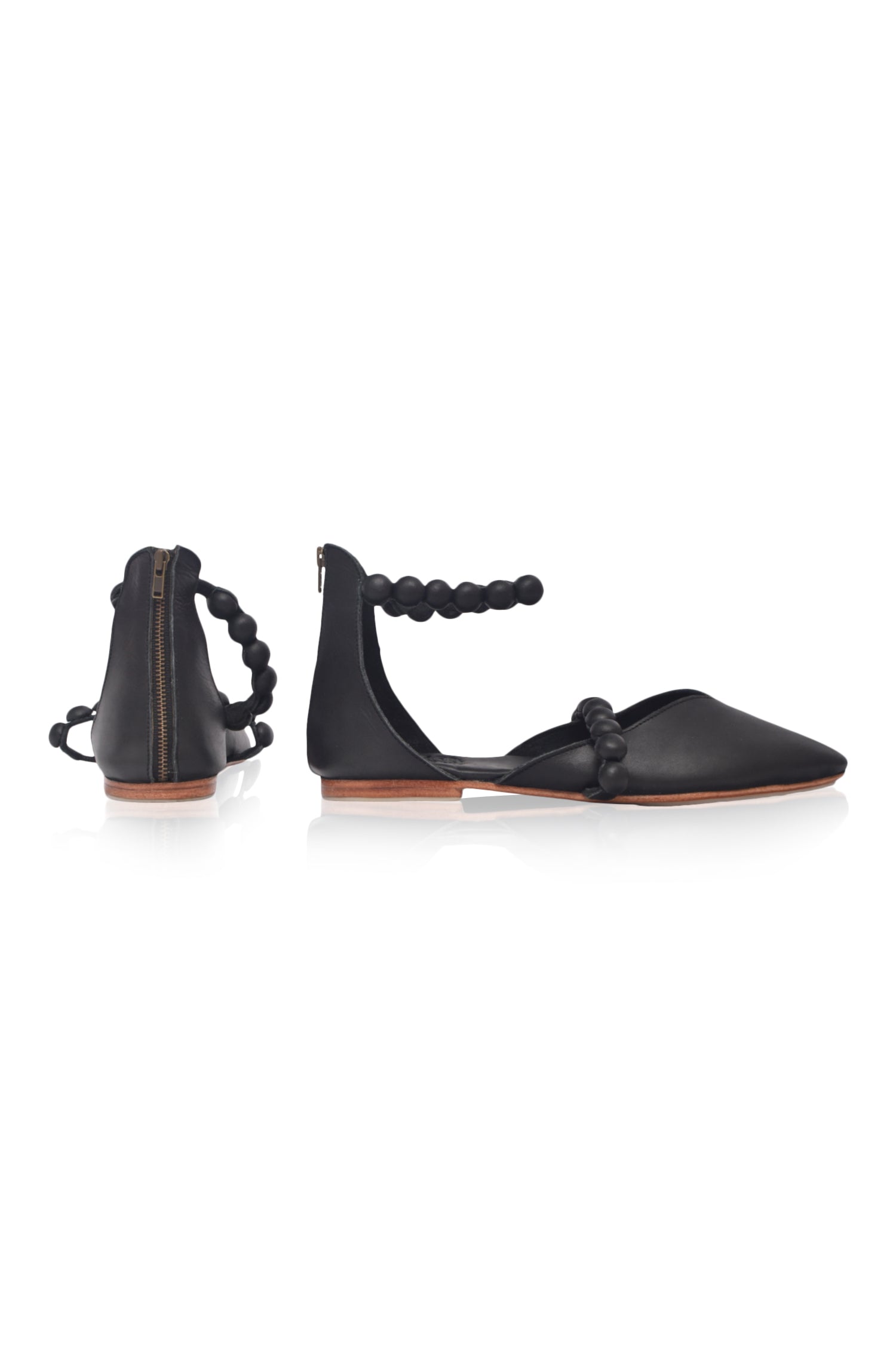 Black genuine leather ankle strap ballet flats with pointed toe and leather-wrapped buttons — view 5