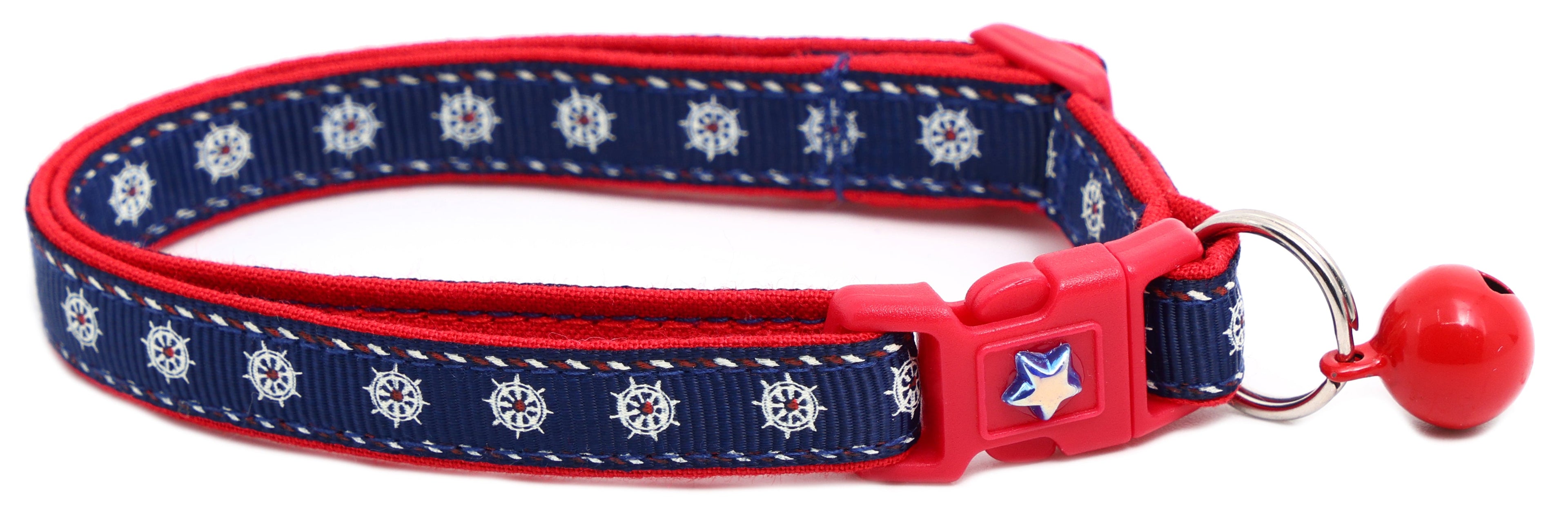 Ships wheels breakaway cat collar in red and navy cotton with a jingle bell — view 2