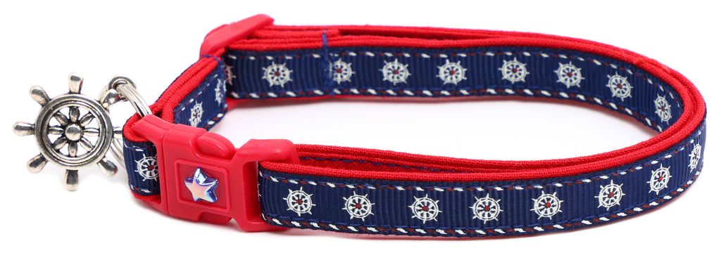 Ships wheels breakaway cat collar in red and navy cotton with a jingle bell — view 3