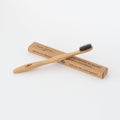 Eco-friendly bamboo toothbrush with soft whitening bristles and a natural wooden handle