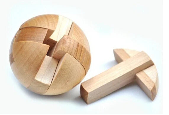 Classic wooden puzzle with four colorful geometric cubes displayed in a custom rectangular wood frame — view 3