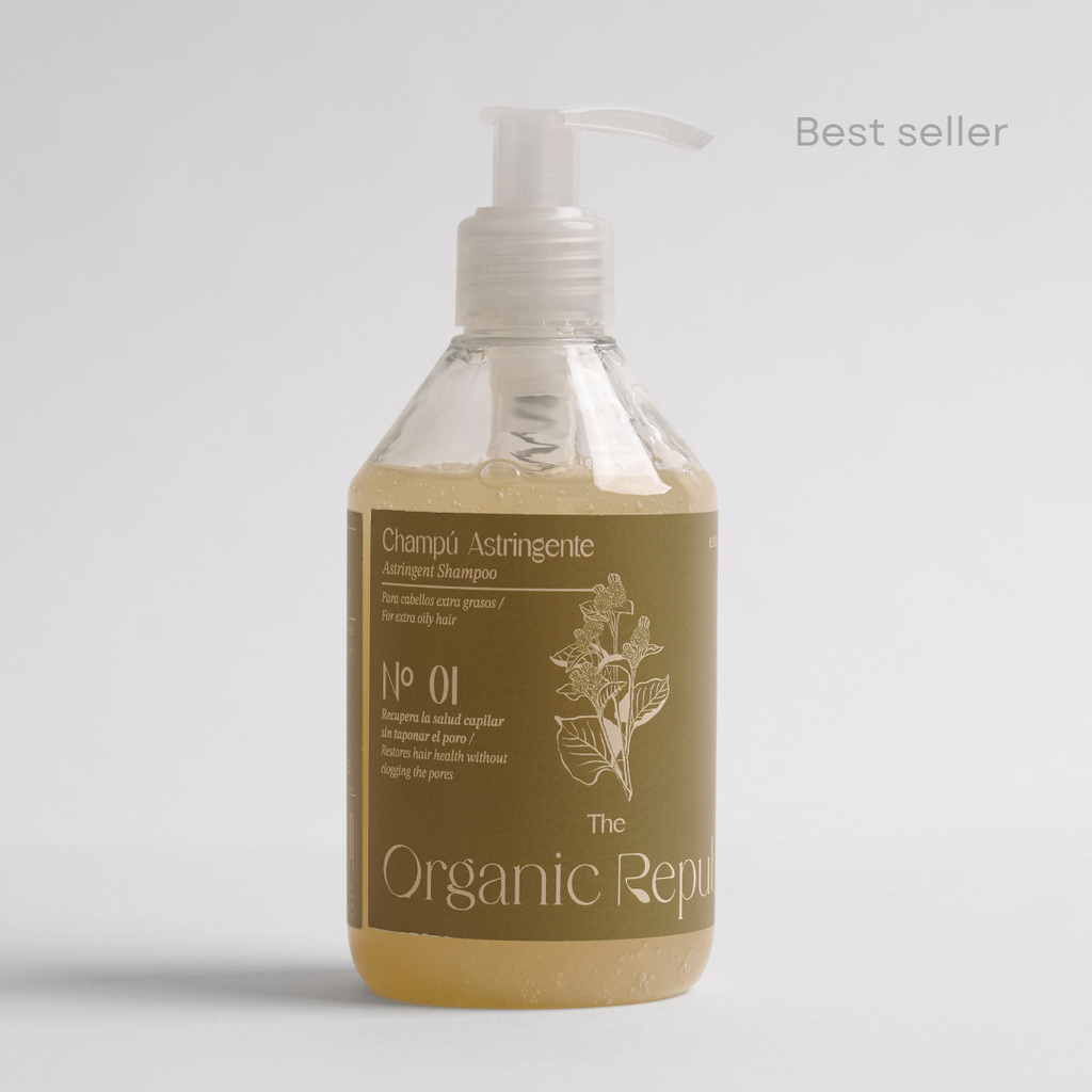 Natural astringent liquid shampoo bottle for oily hair with fresh citrus ingredients on white background
